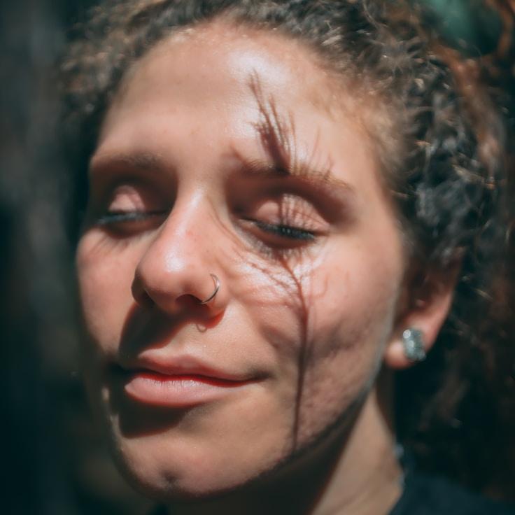 Kaveri Mehta, Lead Design Curator at Cradle Sphere Library, reviewing corporate floral arrangements